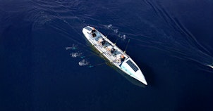 44west rowing boat at sea overhead