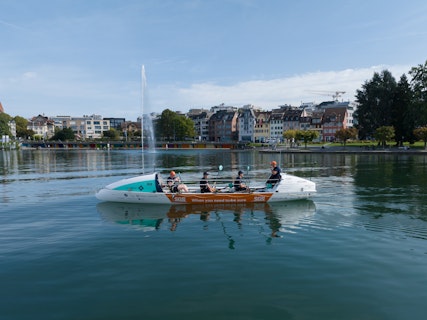 SGS x 44west boat on the lake in front of the fountain