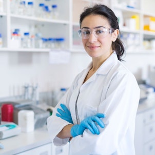 Scientist Standing with Arm Crossed