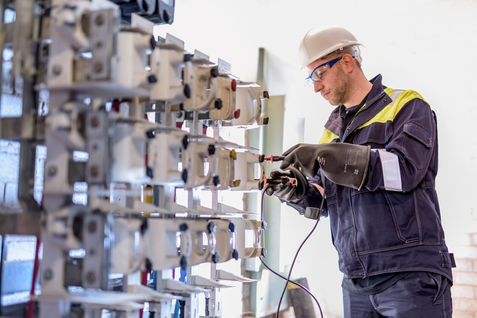 Worker Testing Circuit Breakers in Electricity Substation