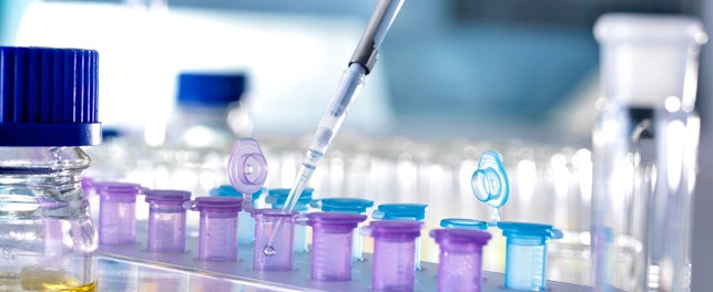 Solution Being Pipetted into Test Tubes for Analysis in Laboratory