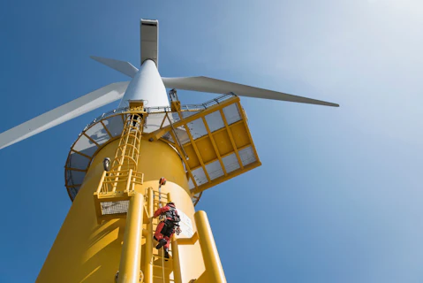 Engineer Climbing Wind Turbine