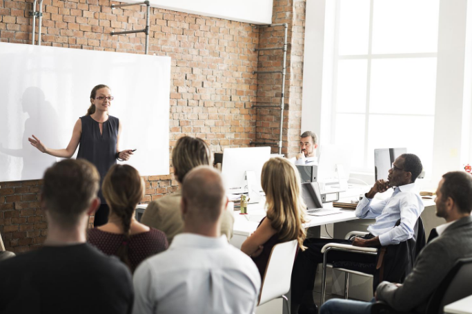 female teaching in front of the class