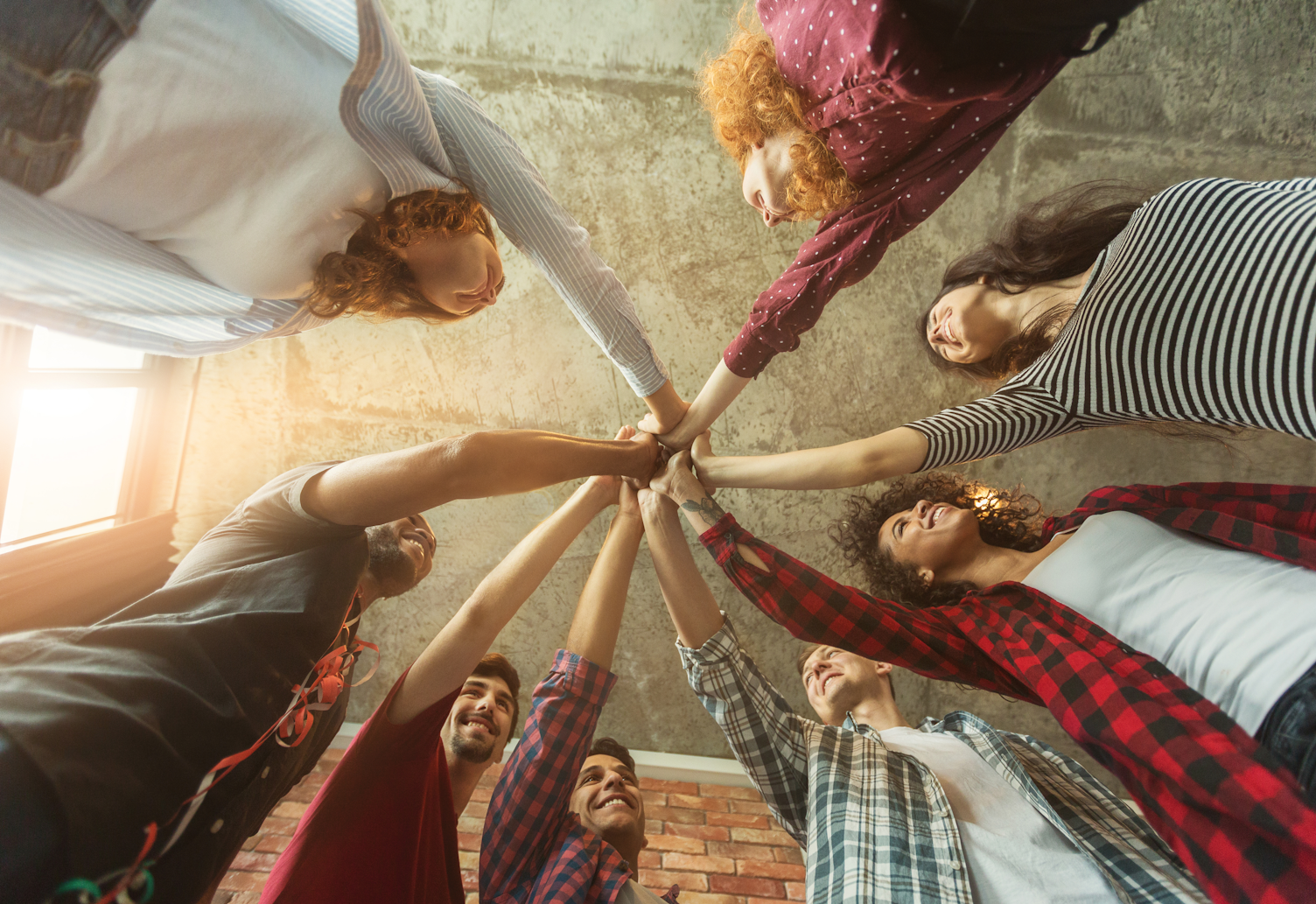 Group of Colleagues Holding Hands Together