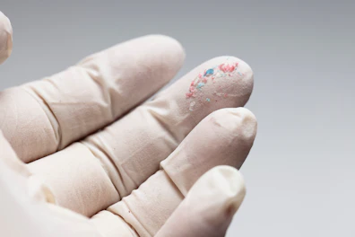 Close up View of Fingertips with Micro Plastic
