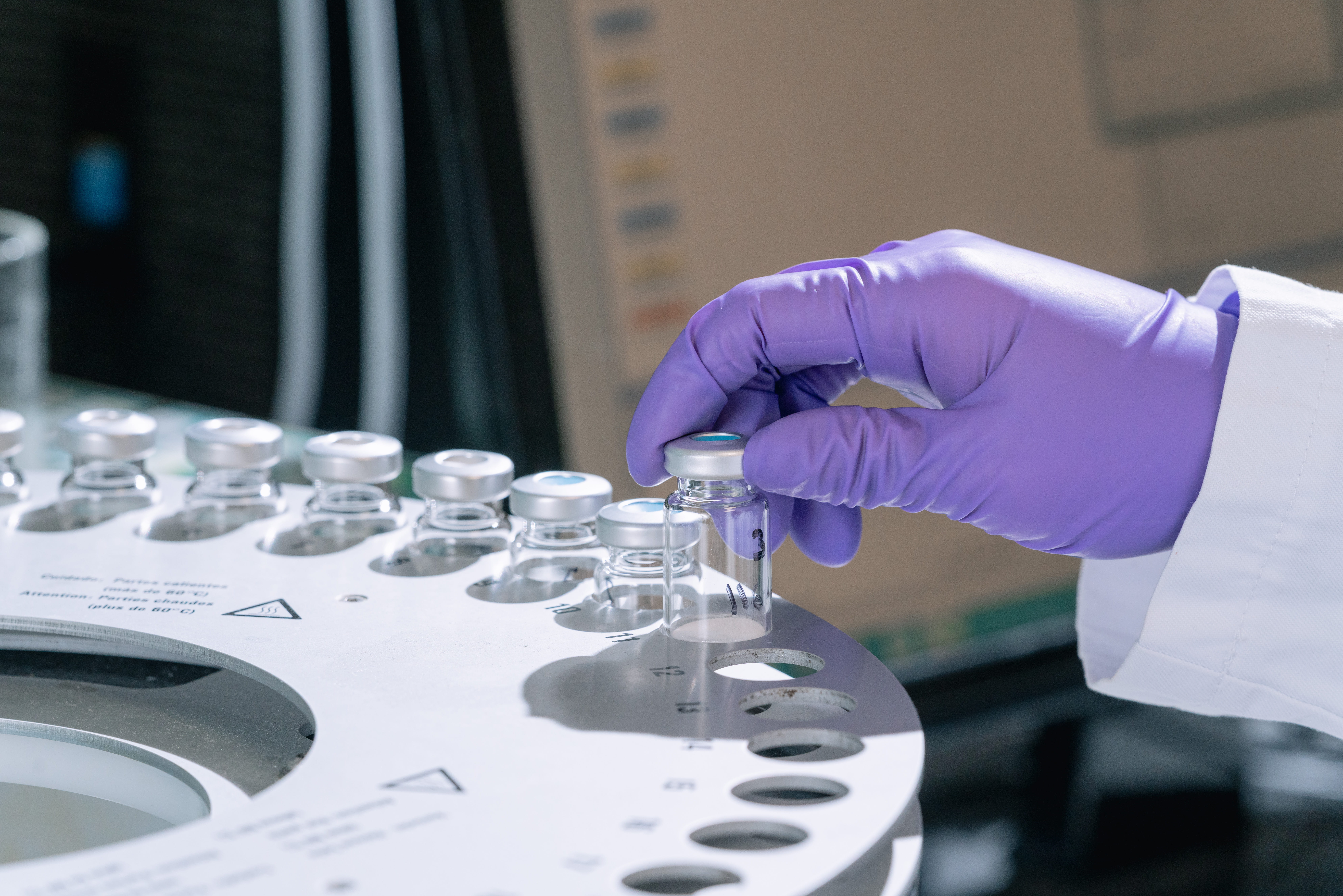 Blue capsules in a belt rotary factory machine