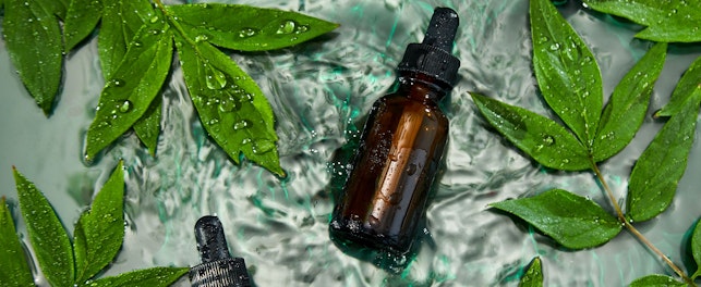 bottle with herbal serum oil cosmetic ad simple