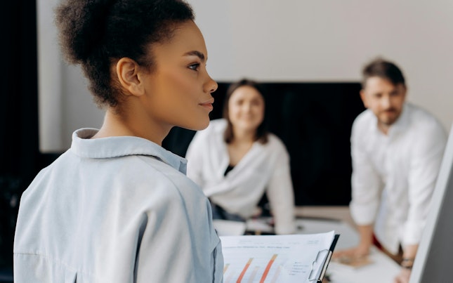 Businesswoman Presenting to Colleagues