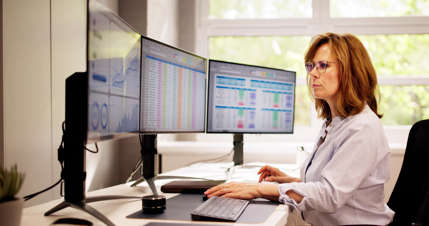 Computer Spreadsheet Data Analyst Woman Using Multiple Screens