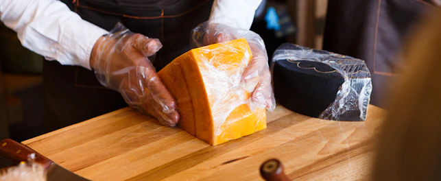 Cutting Cheese on Table