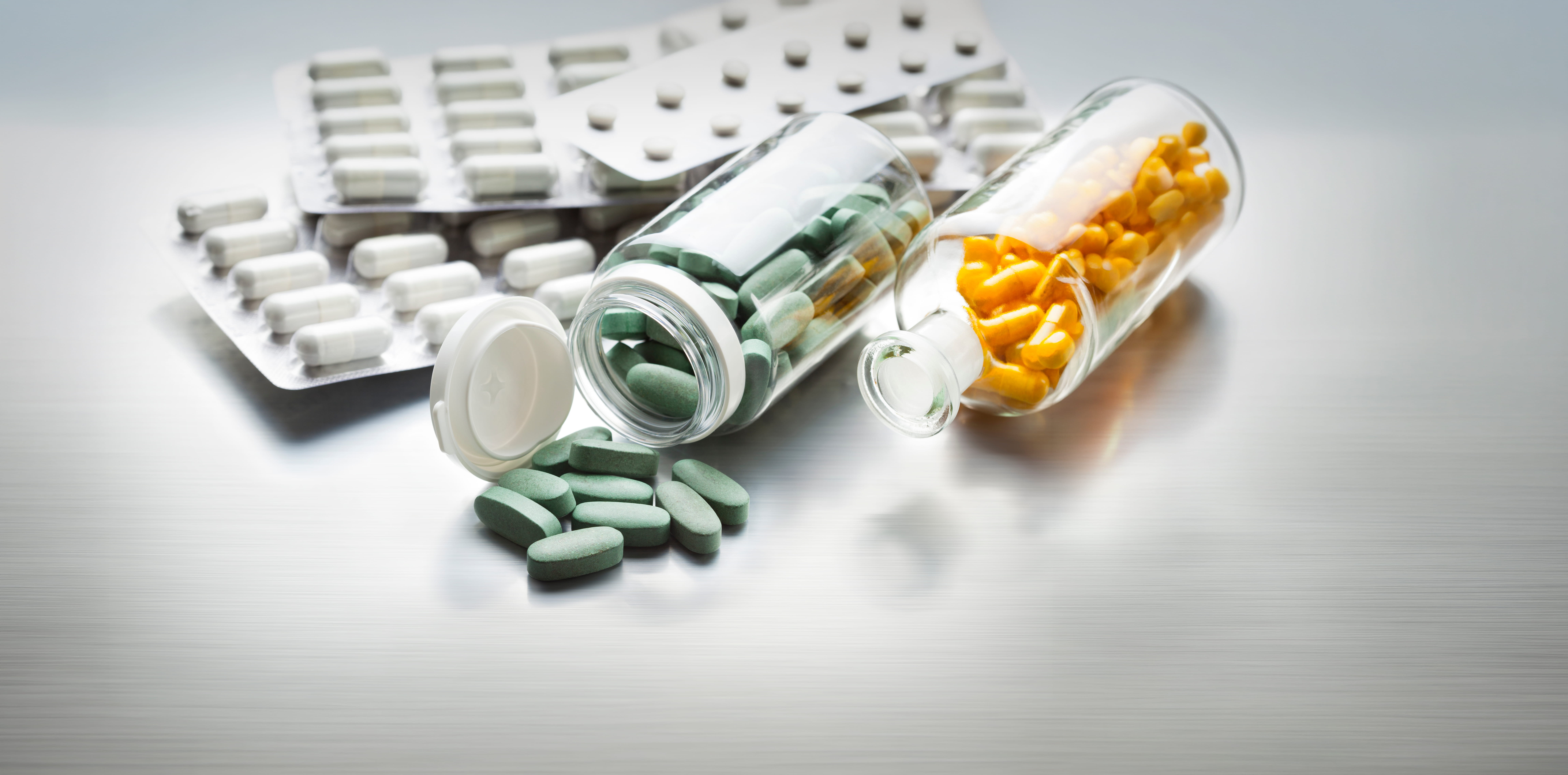 Different Medicines on a Gray Metal Table