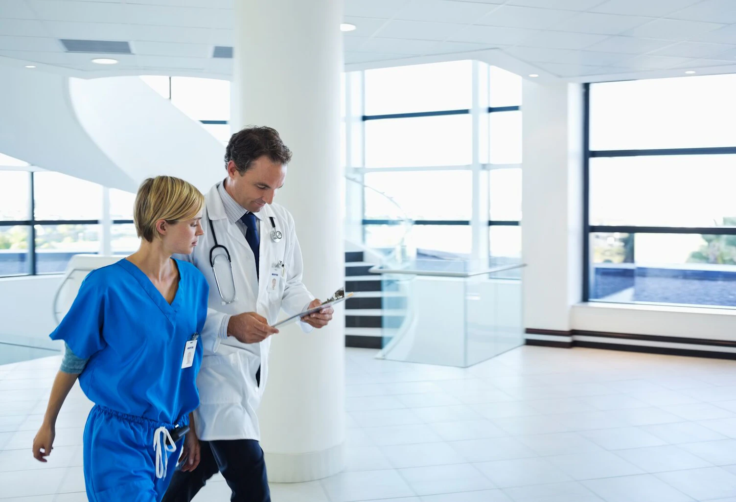 Doctor and Nurse Talking in Hospital