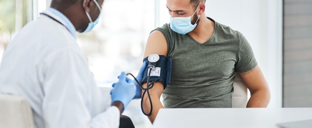 Doctor Measuring Blood Pressure of a Patient