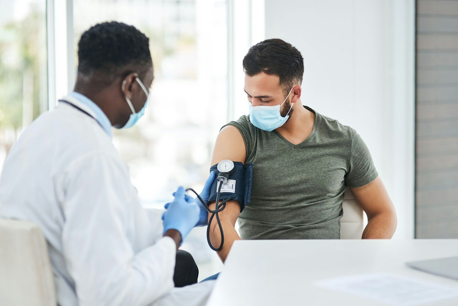 Doctor Measuring Blood Pressure of a Patient