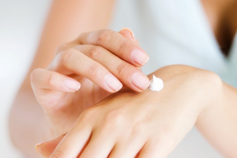 Lady Applying Hand Lotion