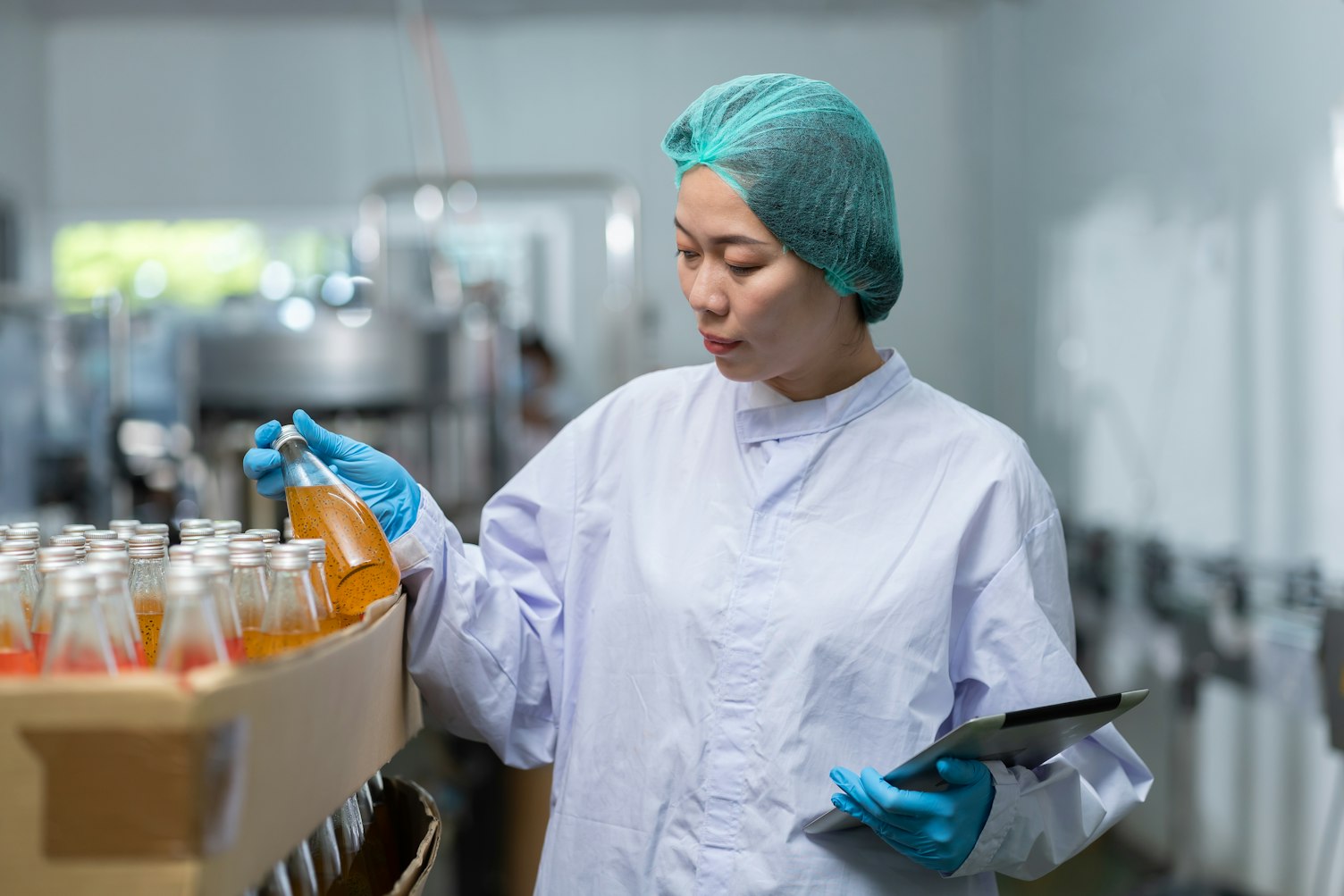 Manufacturer Worker Checking Product Bottles Fruit Juice