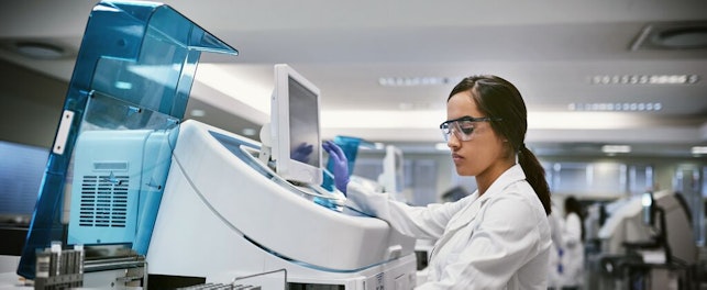 Scientist Using Machine to Conduct a Medical Test in a Laboratory