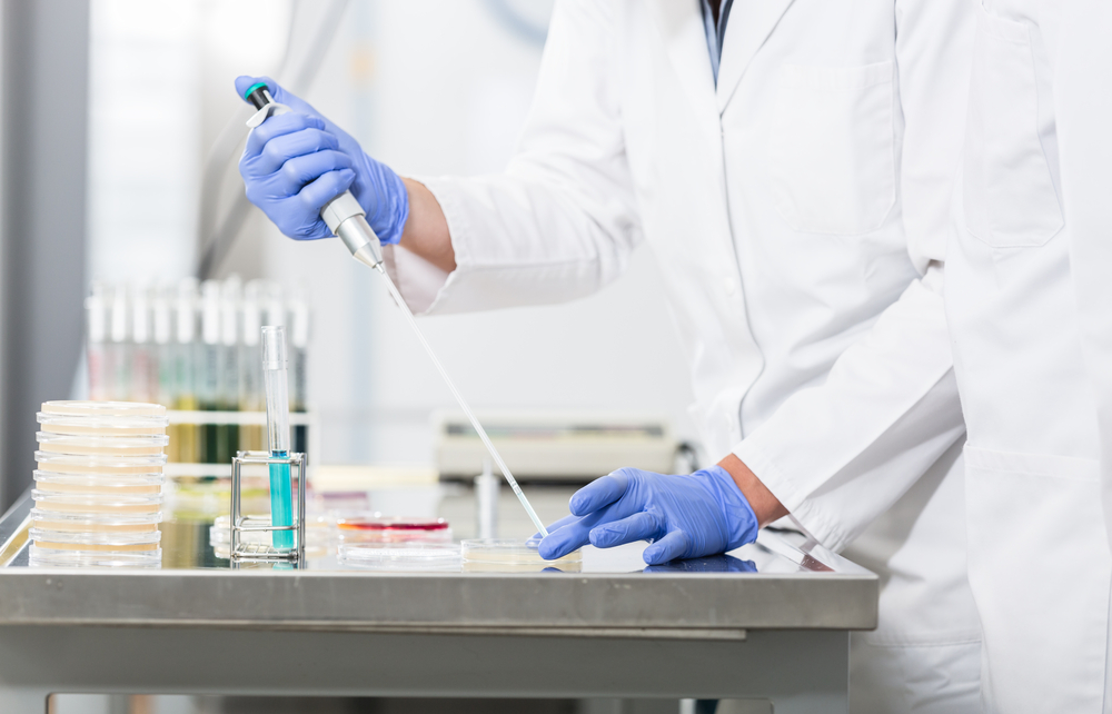 Research operator preparing samples in petri dishes