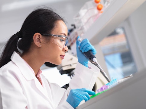 Scientist pipetting a sample