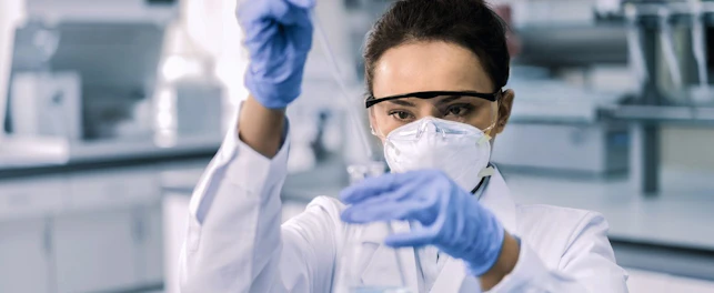 Scientist Testing Chemicals in a Laboratory