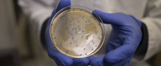 Scientist with Petri Dish