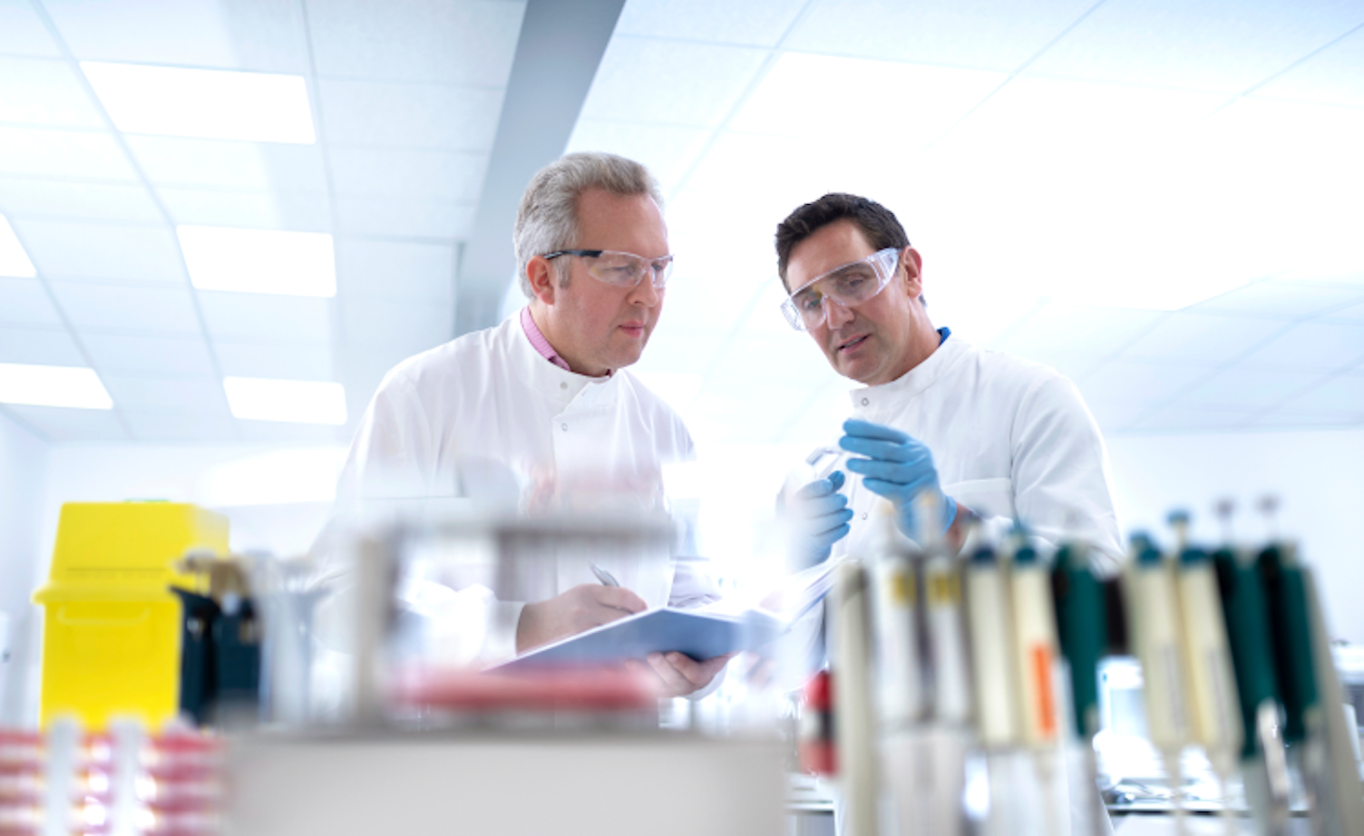 Scientists Discussing Test Results in Laboratory