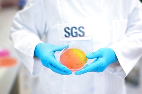SGS Microbiology Services Lab Scientist Holding Specimen