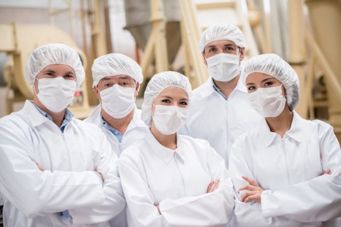 Team of Colleagues Working in Food Factory