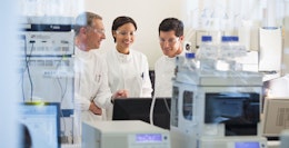 Three Scientists Working in Laboratory