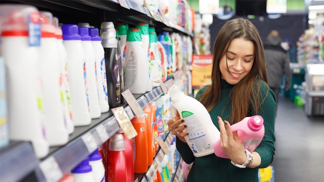 Woman checking detergent products