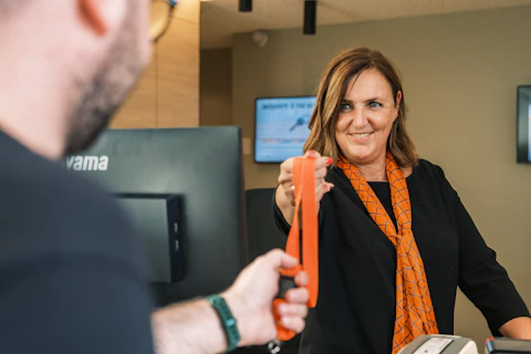 Woman Giving Lace to Man