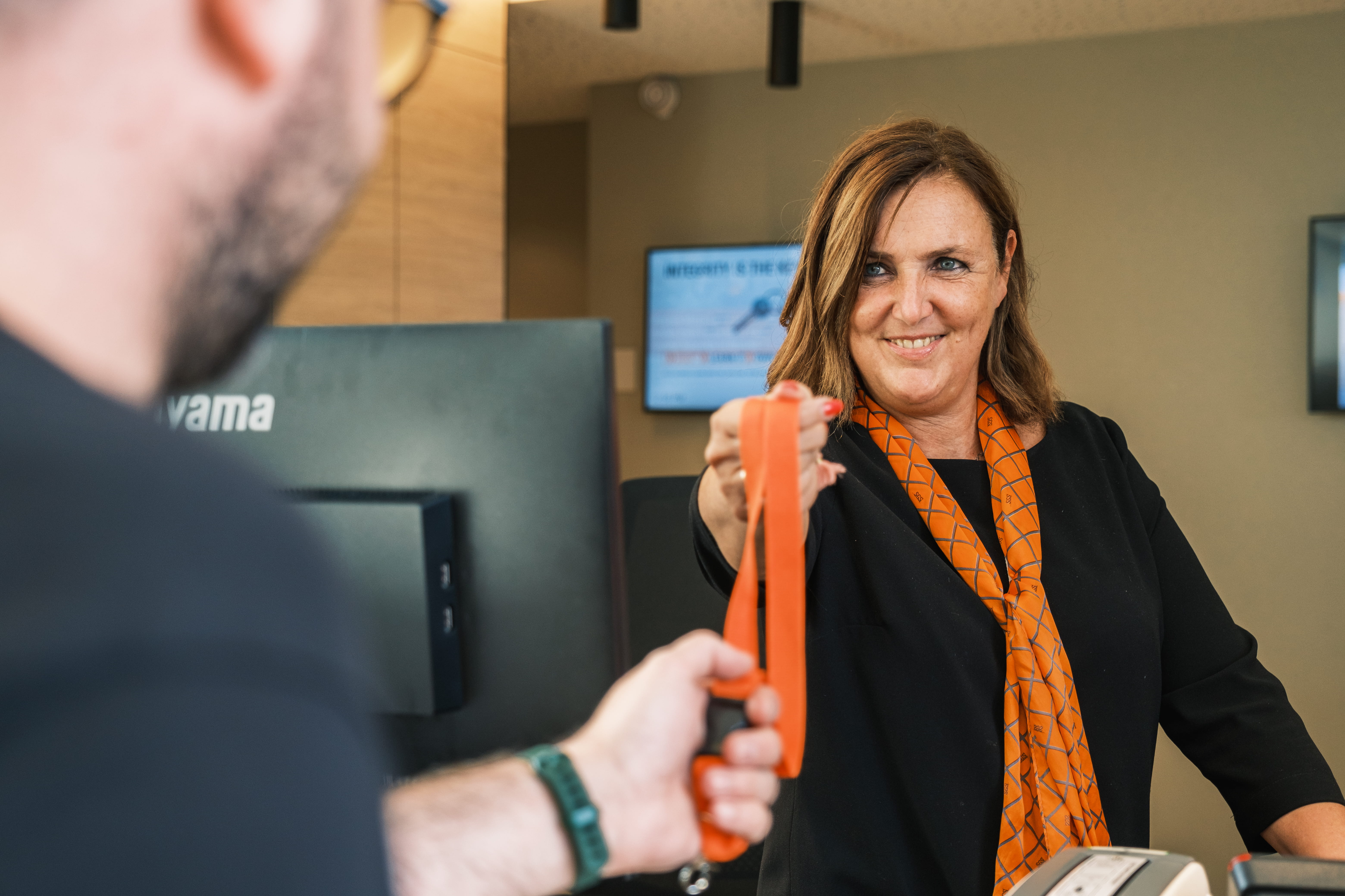 Woman Giving Lace to Man