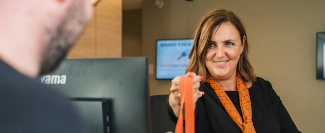 Woman Giving Lace to Man