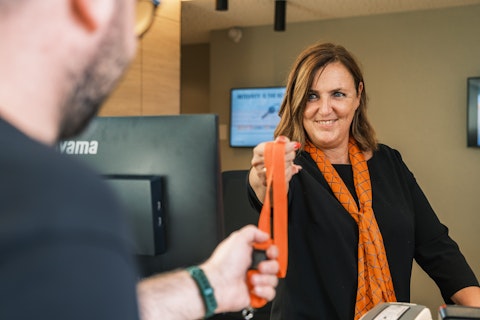 Woman Giving Lace to Man