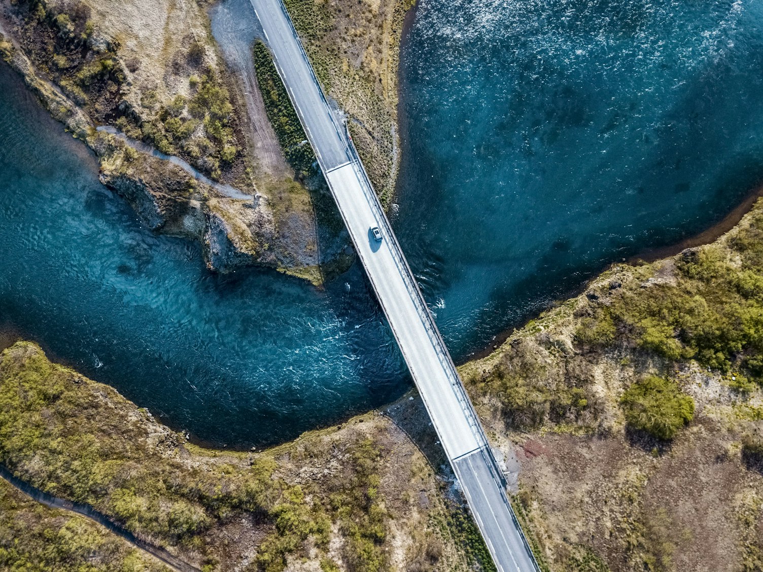 Aerial View of a Bridge over Deep Blue Water