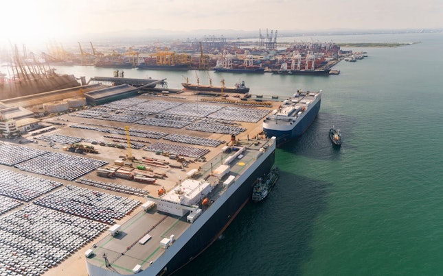 Aerial View of Large Vessels Conveing Cars and Trucks for Export
