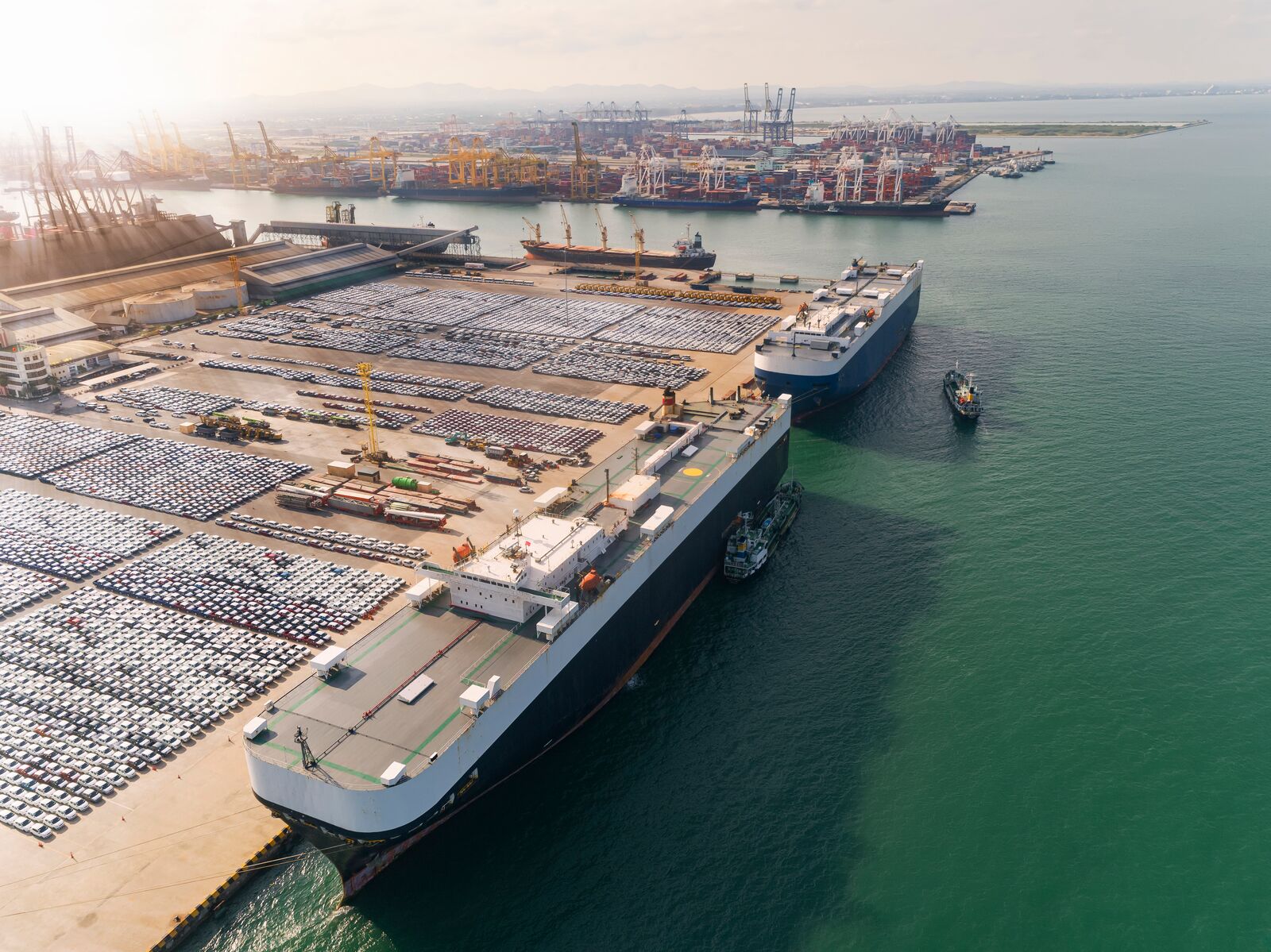 Aerial View of Large Vessels Conveing Cars and Trucks for Export