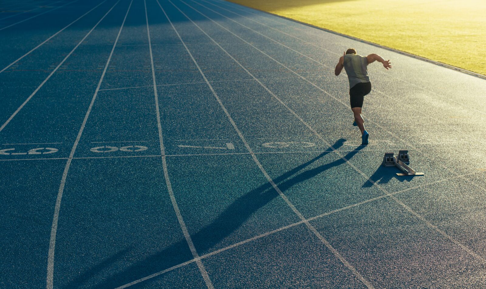 Athlete Running on Artificial Turf