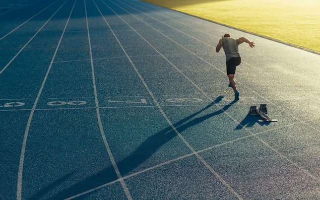 Athlete Running on Artificial Turf