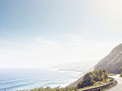A car driving along the Great Ocean Road in Australia