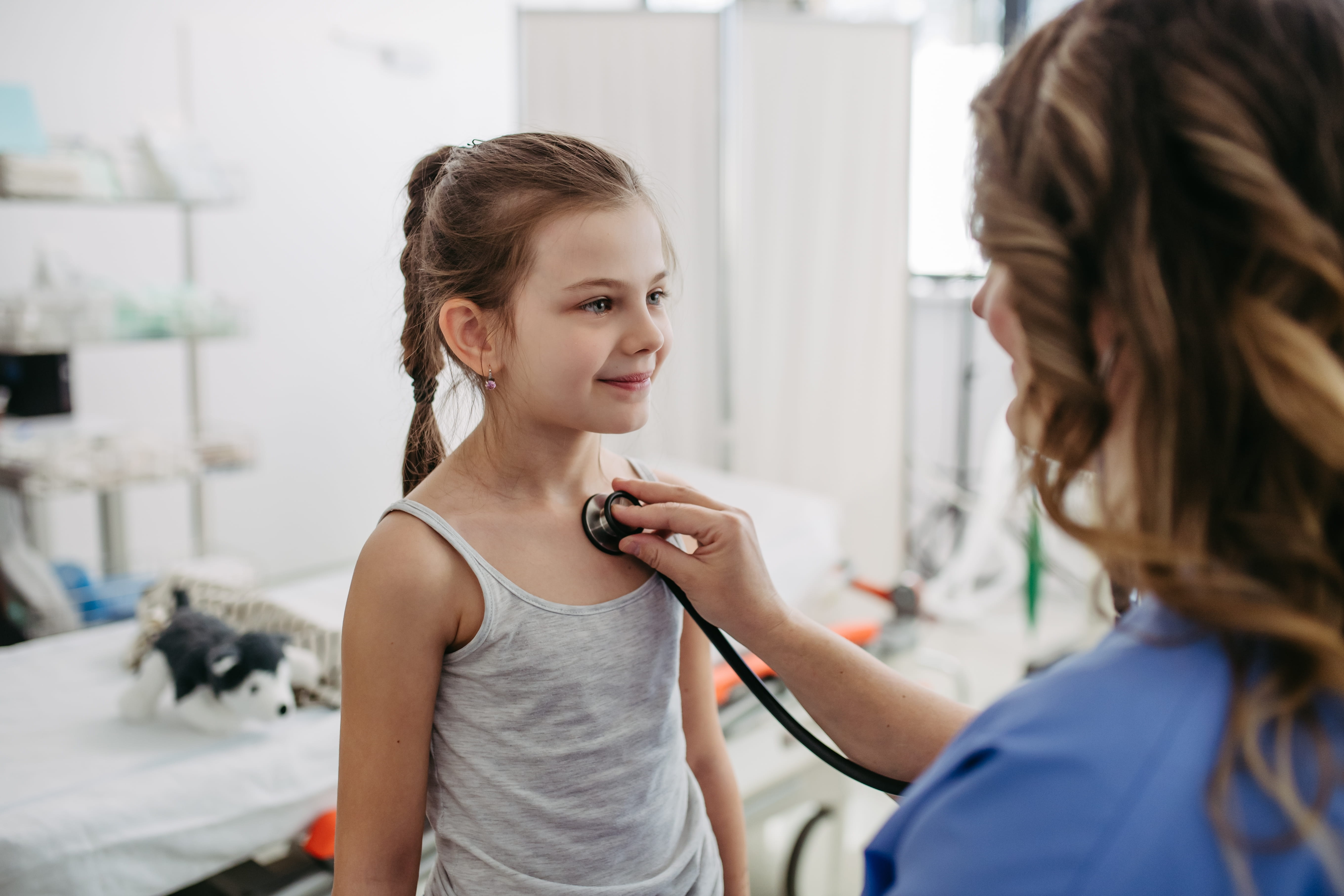 Doctor examining young girl