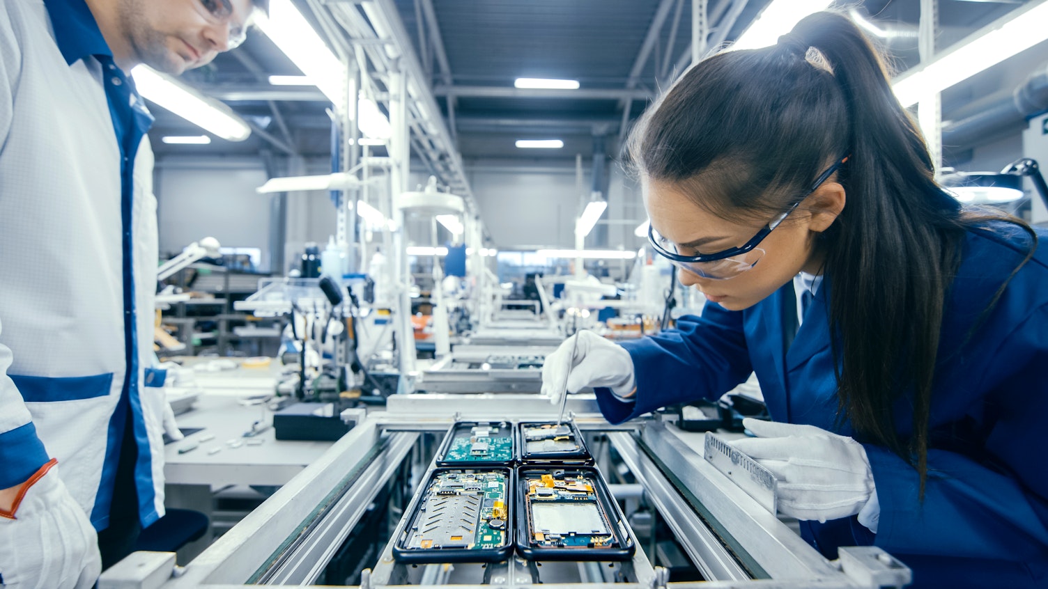 Electronics Factory Technicians Assembling Circuit Boards