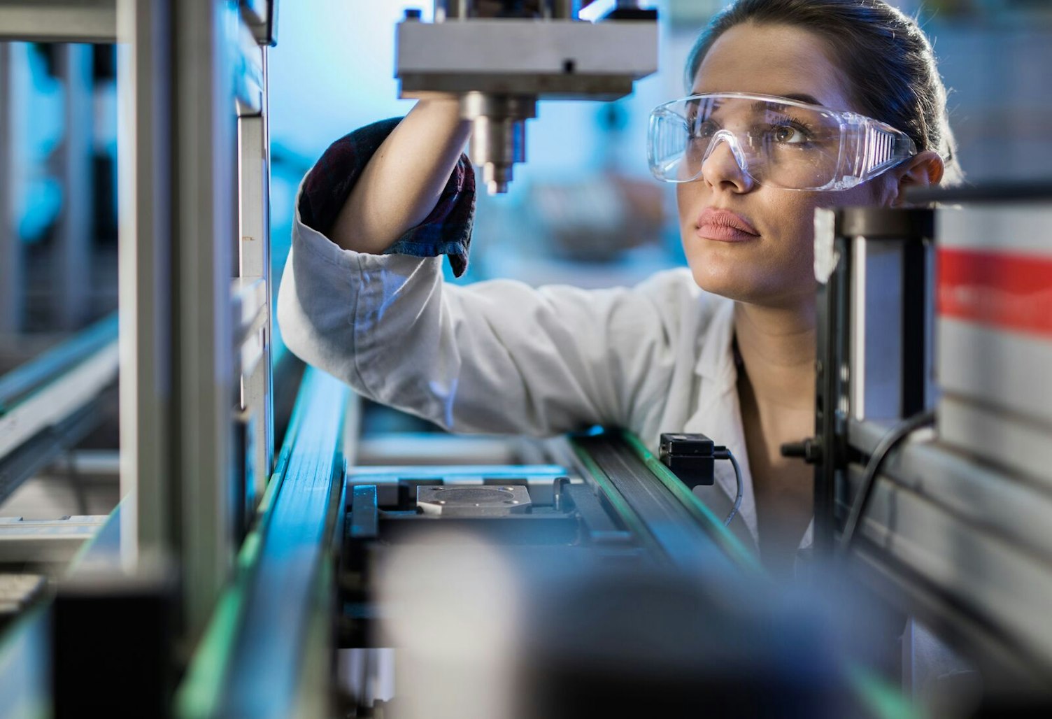 Engineer Examining Machine Part on a Production Line Clip