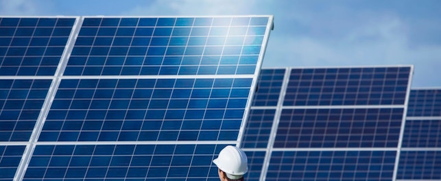 Engineer Inspecting Solar Panels