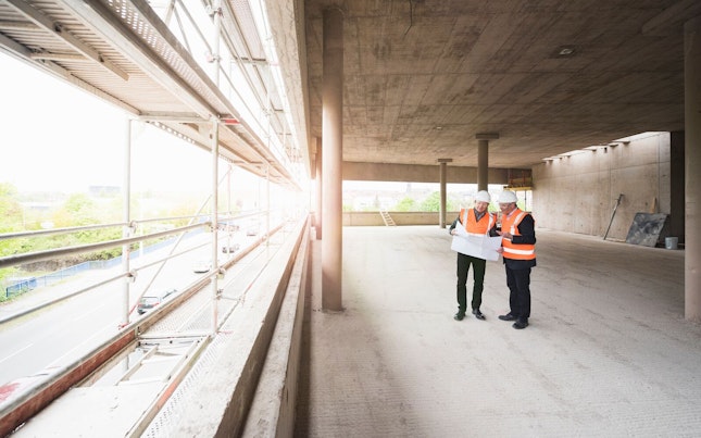 Engineers Checking Construction Plan