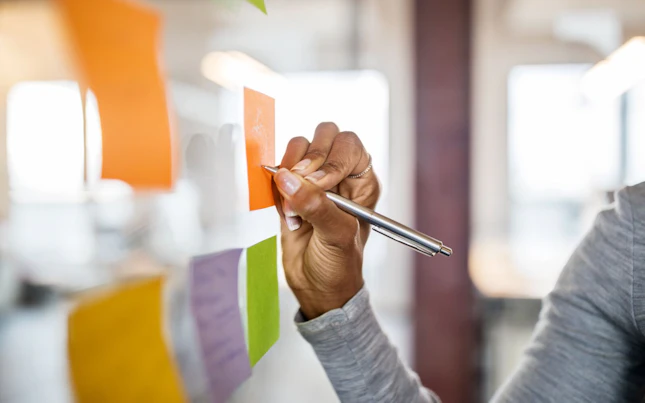 Hand Writing on a Sticky Note