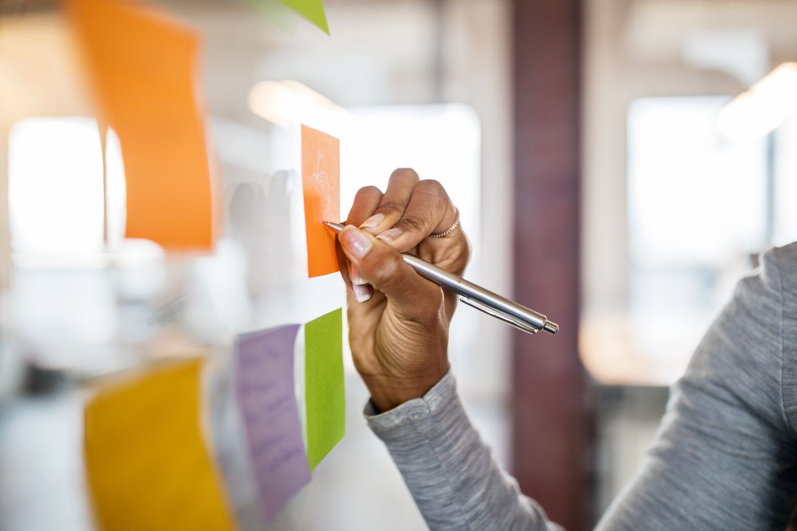 Hand Writing on a Sticky Note