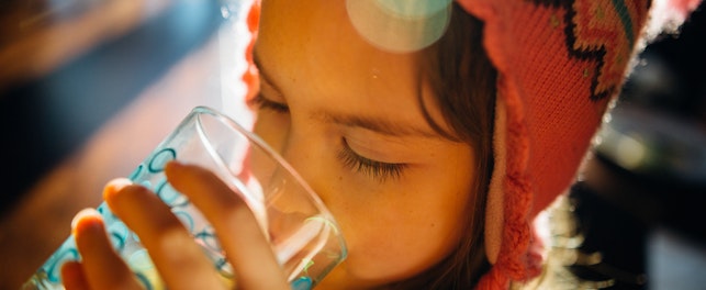 Kid Drinking a Glass of Water