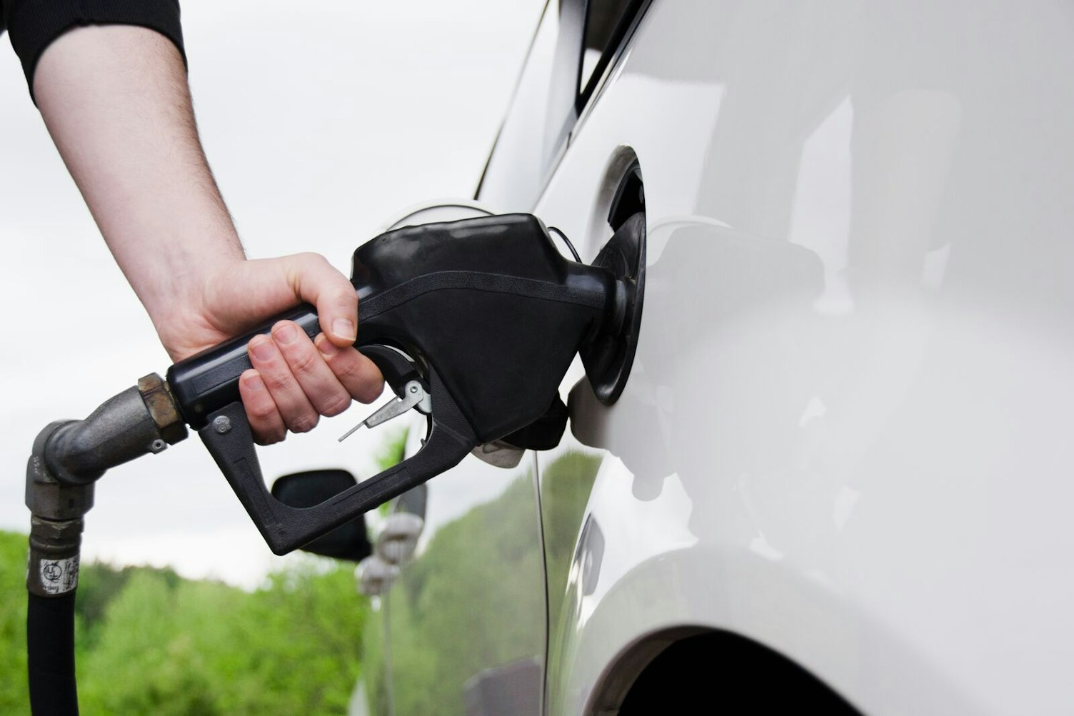 Mans Hand Holding Fuel Pump