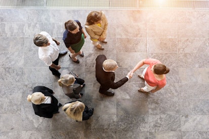 Overhead View of business Team Meeting Client in Office
